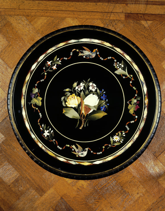 Close view from above of inlaid round table top in the Drawing Room at Dunster Castle