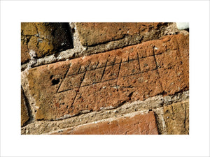 Graffitti sundial carved in the brickwork at The Workhouse, Southwell, Nottinghamshire, a C19th institution for paupers