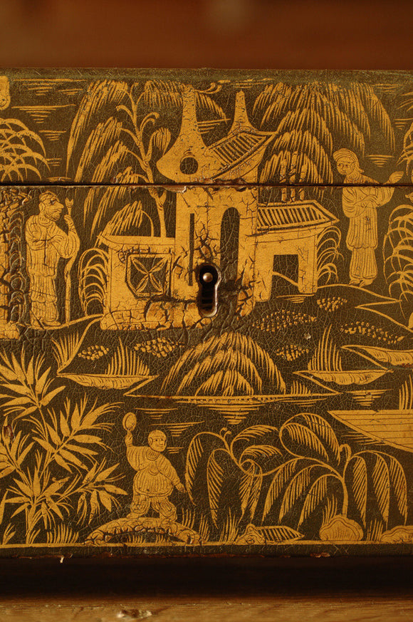 Close view of a green lacquer decorated tea caddy, English, in the Grey Room at Snowshill Manor, home of collector Charles Wade