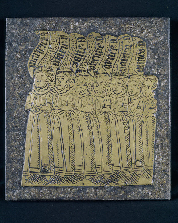 Replica of an Arundell family brass, a group of ladies with a Latin inscription, at Trerice, Cornwall, UK