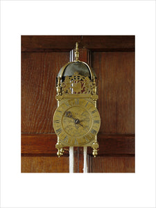 The brass lantern clock c.1665-70 by Thomas Dyde, London, in the Great Chamber at East Riddlesden Hall, West Yorkshire