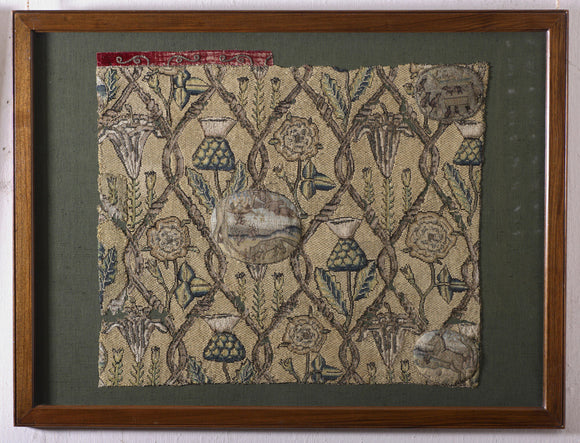 Cushion cover with medallions illustrating fables in a trellis enclosing rose, thistle and lily motifs, and a fox devouring nestlings that have fallen out of their nest, at Hardwick Hall, Derbyshire