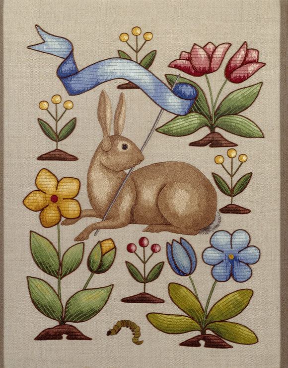 Detail of embroidered panel by Joan Lander featuring a design of a rabbit holding a pennant surrounded by stylized flowers, in the Turret Dressing Room at Sunnycroft