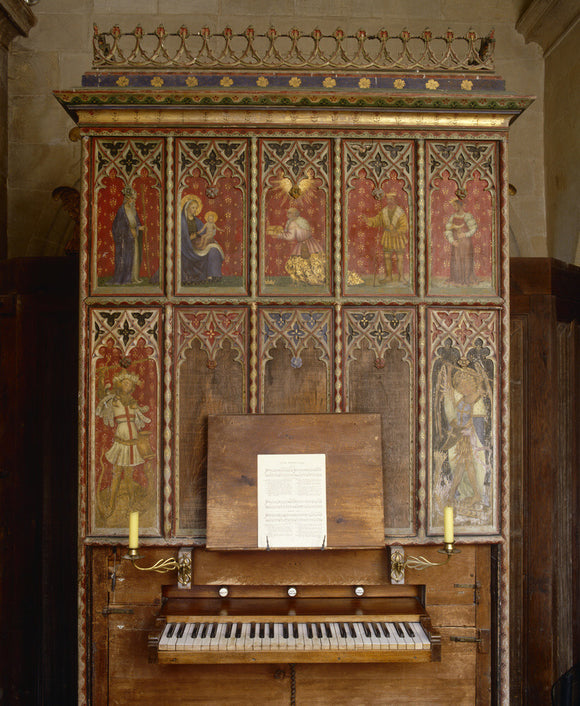 Organ decorated with painted panels depicting religious figures, in the Parish Church of All Saints at Great Chalfield Manor, near Melksham, Wiltshire
