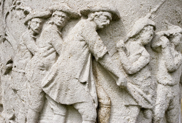 Close view of a relief on an ornamental urn at Polesden Lacey, near Dorking, Surrey
