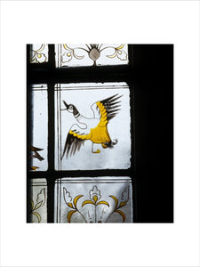 William Morris stained glass panel of a farmyard duck flying, in the Ground Floor passage at Red House