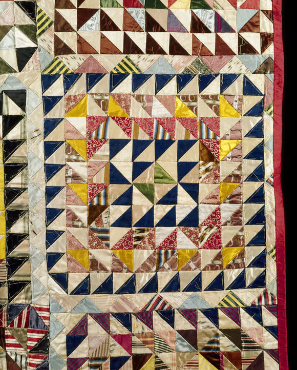 A detail of the patchwork quilt from the Quantoxhead Suite Bedroom at Dunster Castle