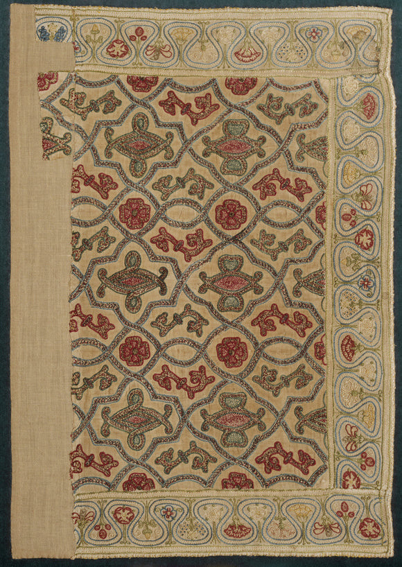 View of a small embroidered cushion cover at hardwick