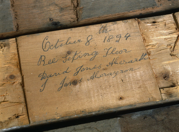 Close up of signed floorboards (1894) uncovered during restoration at Llanerchaeron, a Nash house designed in the 1790's
