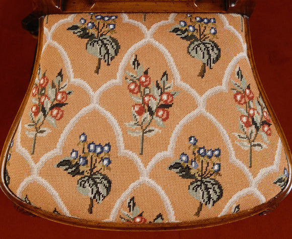 George I style walnut dining-chair tapestry seat in a repeat flower design embroidered by 3rd Lord Bearsted, in the Dining Room at Upton House