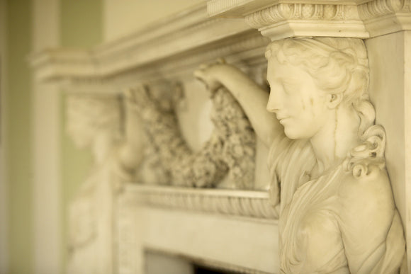 The Adams fireplace in the Long Gallery at Croome Court, Croome Park, Worcestershire, with life-size marble Nymphs of Flora