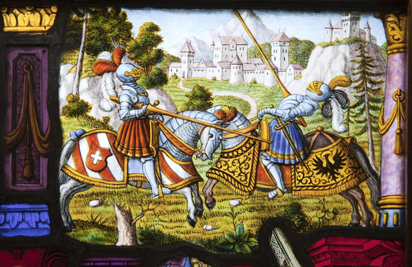 A sixteenth or seventeenth century Swiss-German stained glass panel with a jousting scene, in the Hall at Upton House, Warwickshire