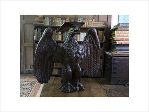 Oak lectern in the form of an eagle, originally a ship's figurehead of c.1800, in the Library at Baddesley Clinton, West Midlands.