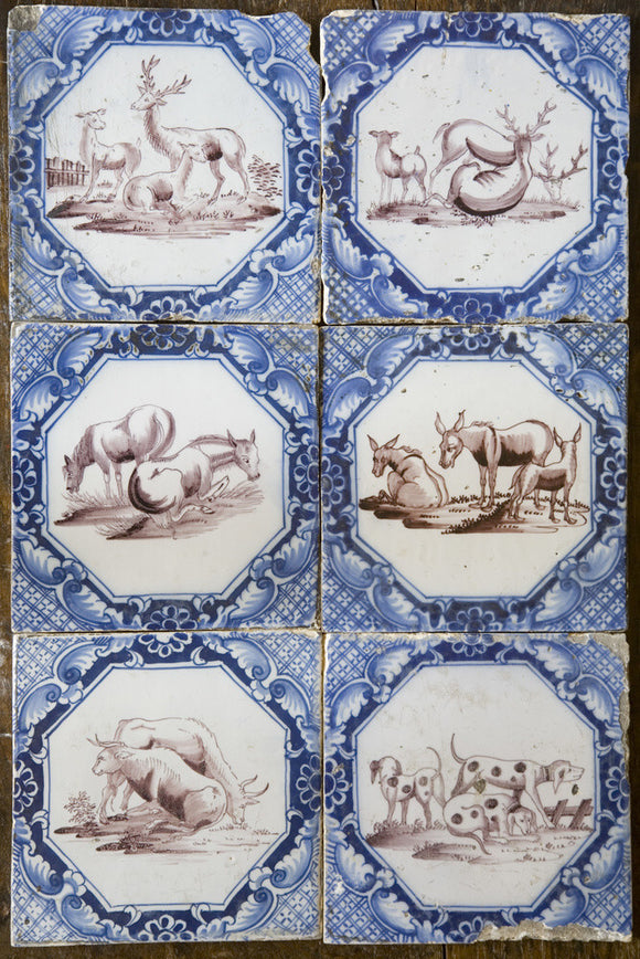 Blue and white Dutch tiles with cattle, deer and hound motifs at Baddesley Clinton, West Midlands