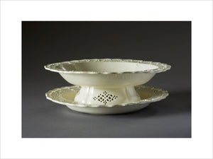 A creamware pierced fruit dish and stand at Hinton Ampner, Hampshire