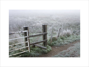A stile on the banks of the River Wey Navigations near Triggs Lock, Send, Surrey on a misty and frosty November day