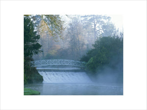 A cascade and bridge between two lakes in Sheffield Park