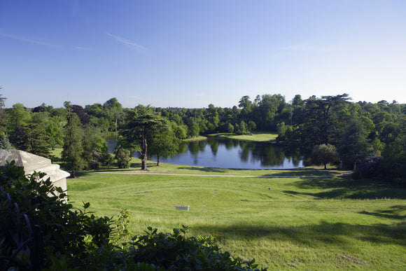 View over the amphitheatre to the lake at Claremont Landscape Garden, Esher, Surrey