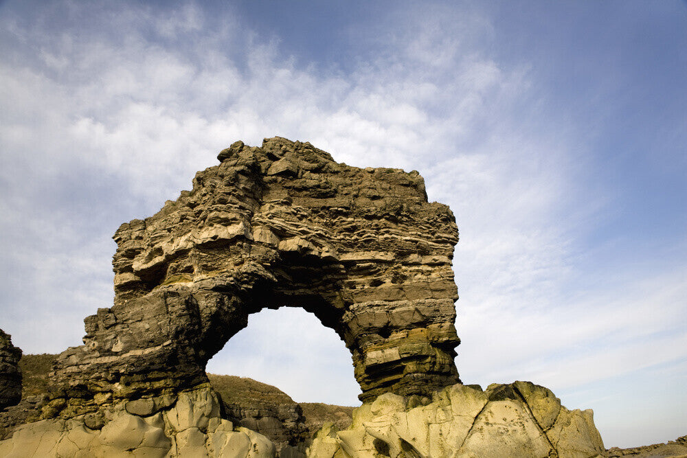 Eroded rocks and magnesian limestone arch near Whitburn, The Leas, Sou ...