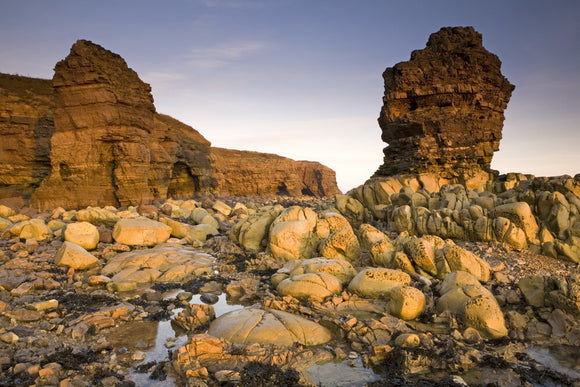 Sunrise on eroded sea stacks and rocks on The Leas, near Whitburn, Tyne & Wear