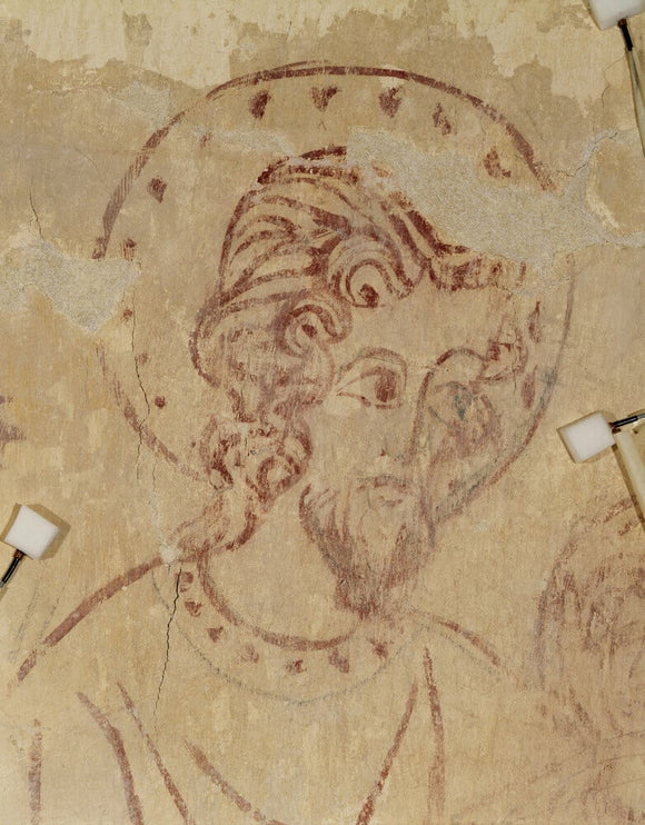 Detail of the face of St Christopher on a wall painting in the Chaplain's Room, off the South Walk in the Nunnery Buildings