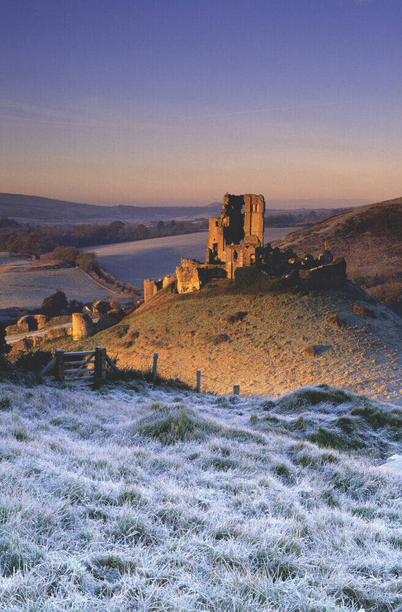 Sunrise at Corfe Castle from East Hill (grid reference SY961823) Wareham, Dorset, UK, on a frosty winters morning