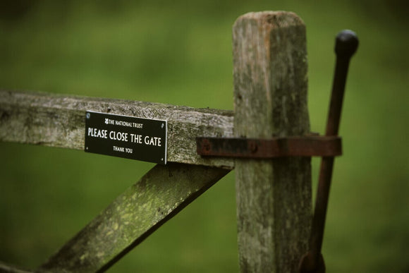 Signs on a gate at the Brockhampton Estate