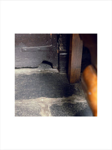 Close shot of a mousehole under the door at Hill Top, Beatrix Potter's home in Sawrey, Cumbria