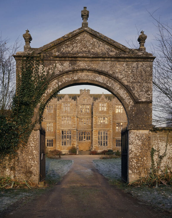 View of the south front of Chastleton seen through the entrance gates