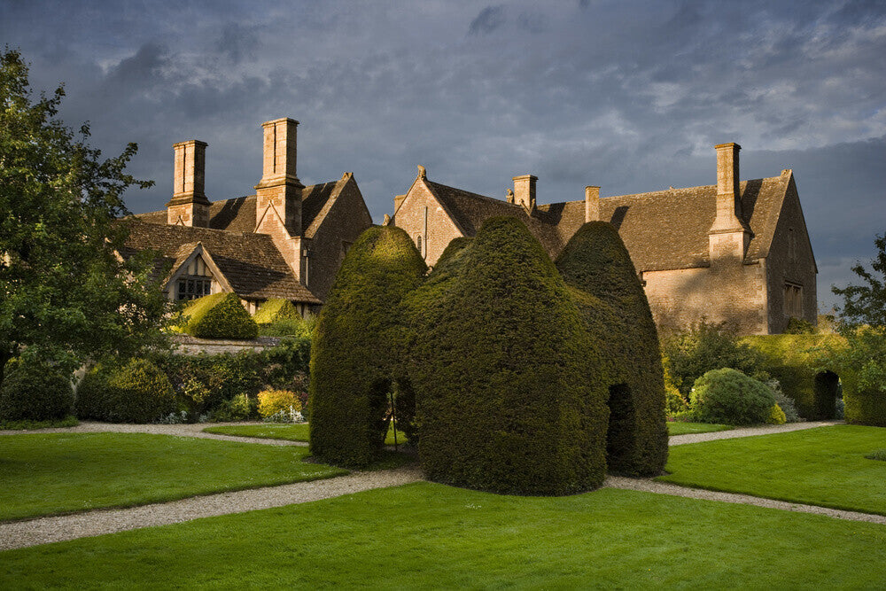 Yew topiary house on the large lawn, or pleasaunce, at the fifteenth-c ...