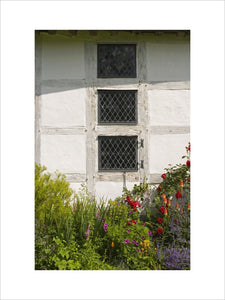 Close view of three diamond-paned windows at Lower Brockhampton House