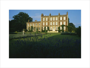 View of the front entrance of Gunby Hall with lawns and lavender beds in the centre and in the foreground