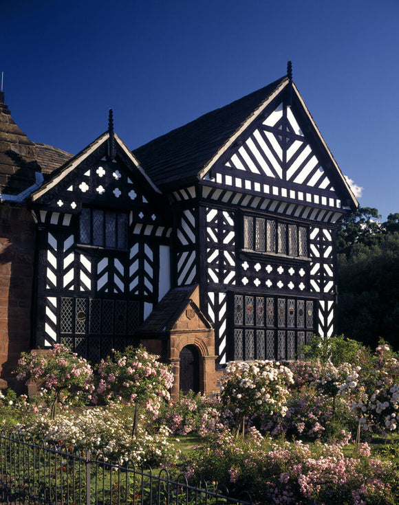 A close view of part of Speke Hall, showing details of the black and white timber