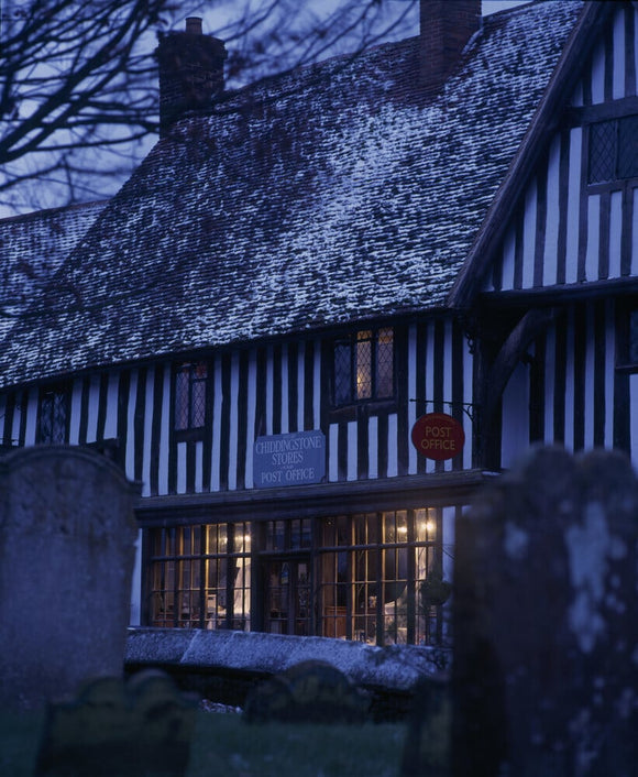 A snowy evening view of the Post Office at Chiddingstone in Kent