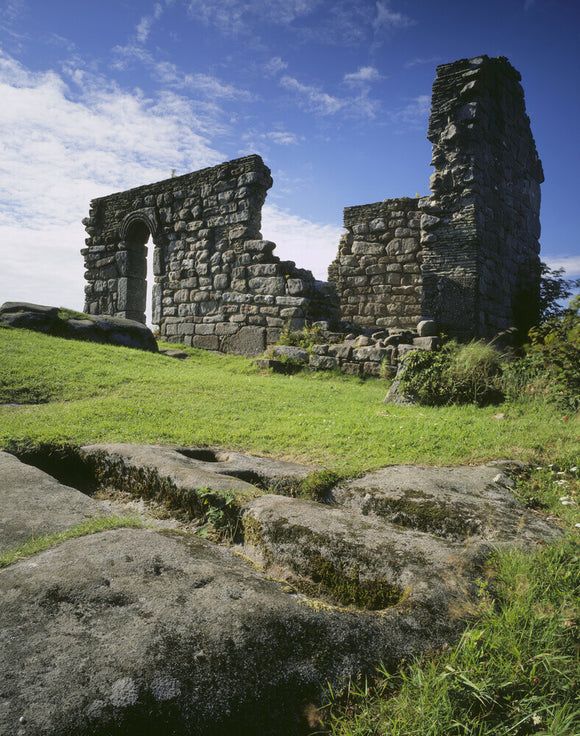 The ruins of St. Patrick's Chapel (romanesque) at Heysham Head on the wild coastal heathland of Morecombe Bay.