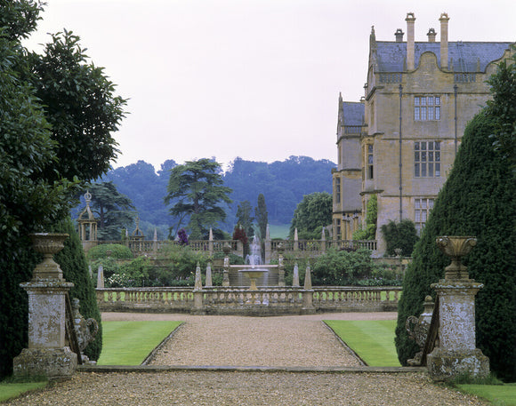 A view through the balustraded walls of the garden at Montacute House, Somerset, with a fountain at the centre