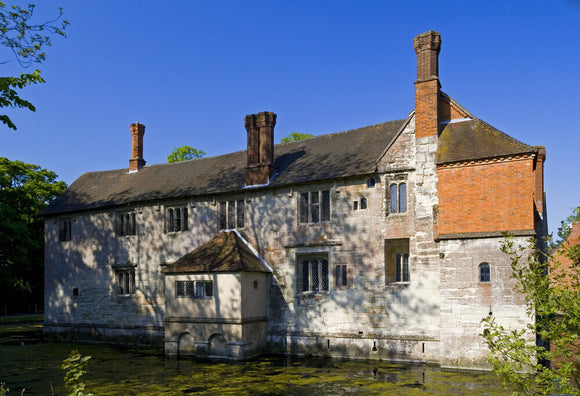 The Family Range, or west side, seen across the moat at Baddesley Clinton, Warwickshire