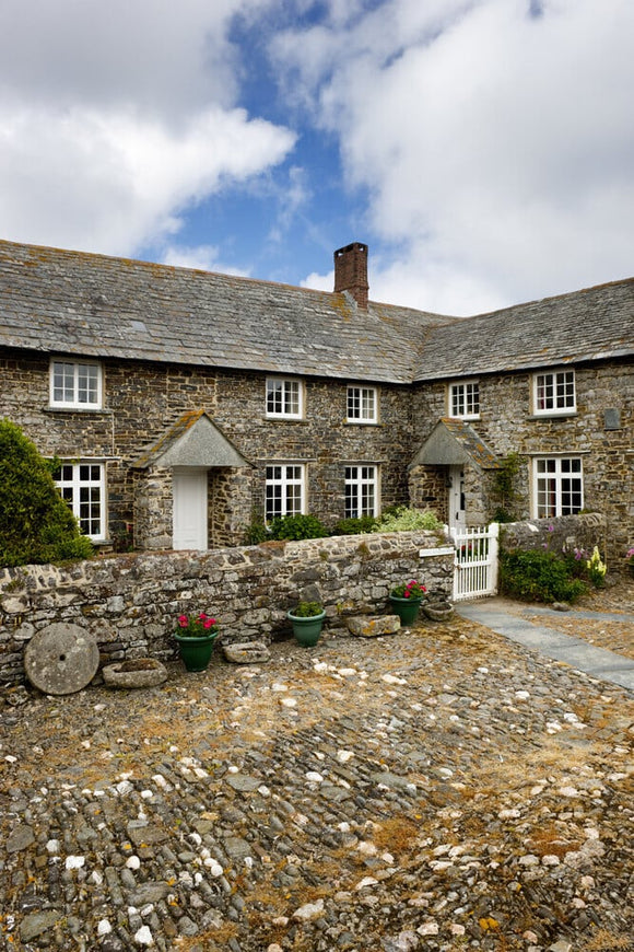 Trevigue Farm, a sixteenth-century farmhouse around a cobbled courtyard, now a National Trust bed & breakfast establishment, at St Gennys,Crackington Haven, Bude, Cornwall