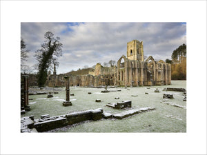 A winter view towards the east end of the Abbey church showing the great east window arch at Fountains Abbey, North Yorkshire