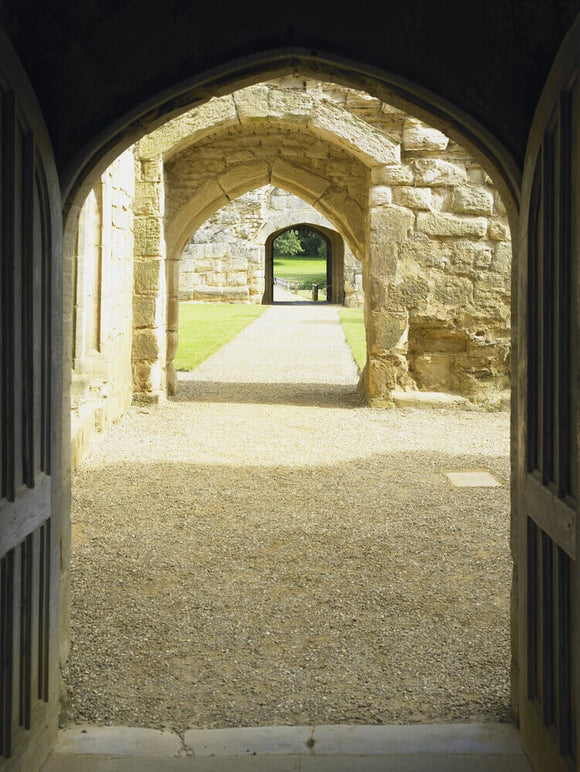 View through the arched doorways from the Gatehouse to the Postern Tower at Bodiam Castle, East Sussex, built between 1385 and 1388