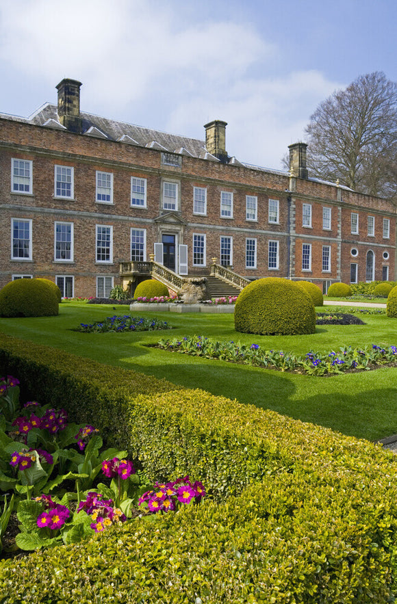 The view across the Victorian Parterre in spring towards the garden front at Erddig, Wrexham, Wales
