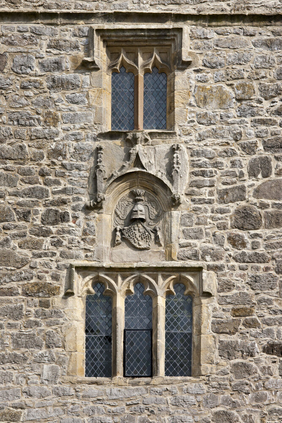An escutcheon displaying the arms of Deincourt quartering Strickland on the west front of the solar tower