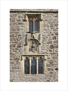 An escutcheon displaying the arms of Deincourt quartering Strickland on the west front of the solar tower