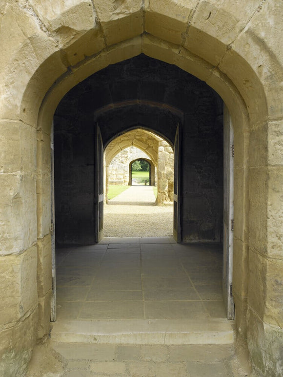 View through the arched doorways from the Gatehouse to the Postern Tower at Bodiam Castle, East Sussex, built between 1385 and 1388