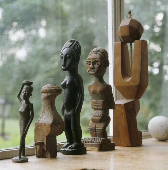 A collection of African/modern sculptures on the window sill at 2 Willow Road