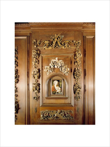 Decorative carved picture surround framing a Madonna and Child in the style of Joos Van Cleve