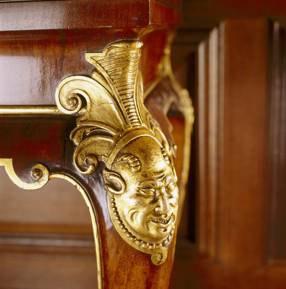 Detail of carved cabriole legs of C18th walnut tables in the Tapestry Room at Antony