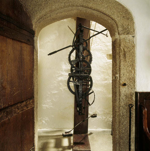 View of the pre-pendulum clock made of wrought iron and mounted on a stout vertical oak beam