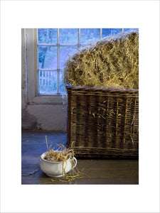 A basket containing straw in the Apprentice House Dormitory at Quarry Bank Mill, Styal