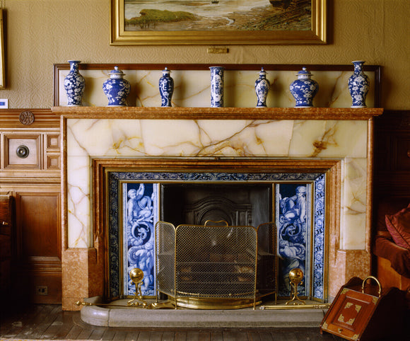 A close view of the Library fireplace made by Forsyth with onyx surround, at Cragside, Northumberland